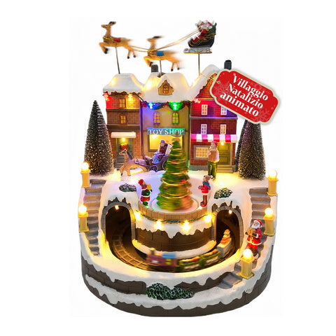 Svítící vánoční vesnička Xmas Town na baterie s LED světly, hudbou, otáčejícím se stromkem, pohyblivým vláčkem a saněmi Santa Clause, 27x25x34 cm